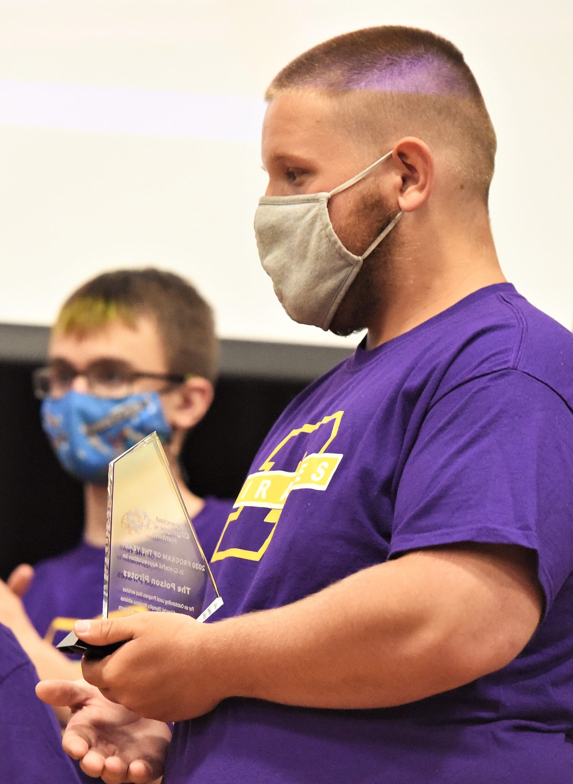 Hunter Greenwood, right, holds the Program of the Year award beside Dominic DiGiallonardo. (Scot Heisel/Lake County Leader)