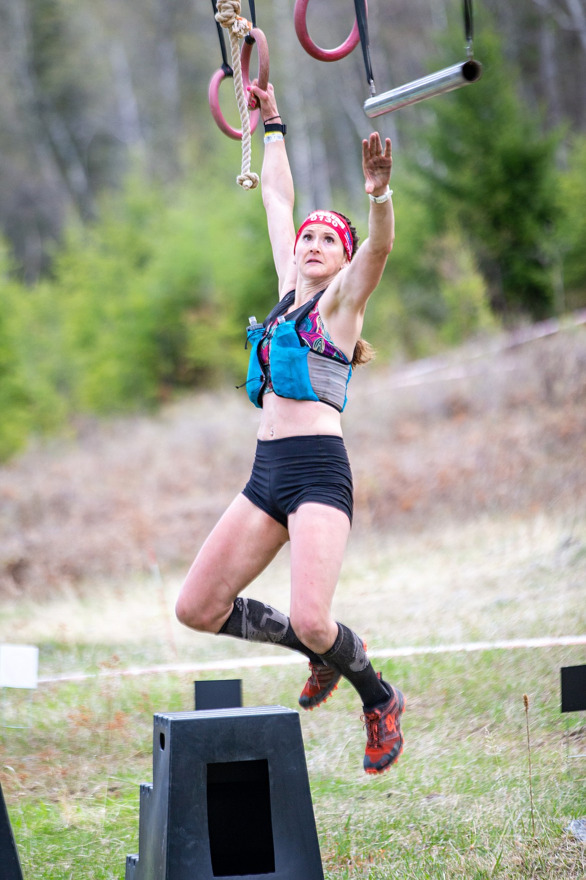 Kaci Monroe, of Bigfork, swings from ring to ring during the Spartan Race in Bigfork last weekend.
Courtesy Mike Roessmann Photography