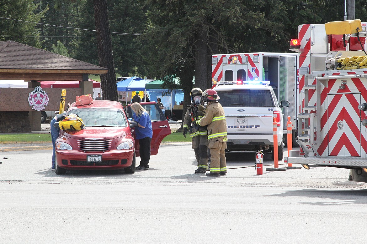 First responders work to extract a passenger from a car that crashed at the intersection of U.S. Highway 2 and Mahoney Road on May 5. Libby Police Chief Scott Kessel said responders took the injured passenger to Cabinet Peaks Medical Center. The driver of the red PT Cruiser was cited for failure to yield right of way. Responders with Libby Volunteer Ambulance, Lincoln County Sheriff's Office, Libby Volunteer Fire Department reported to the scene.