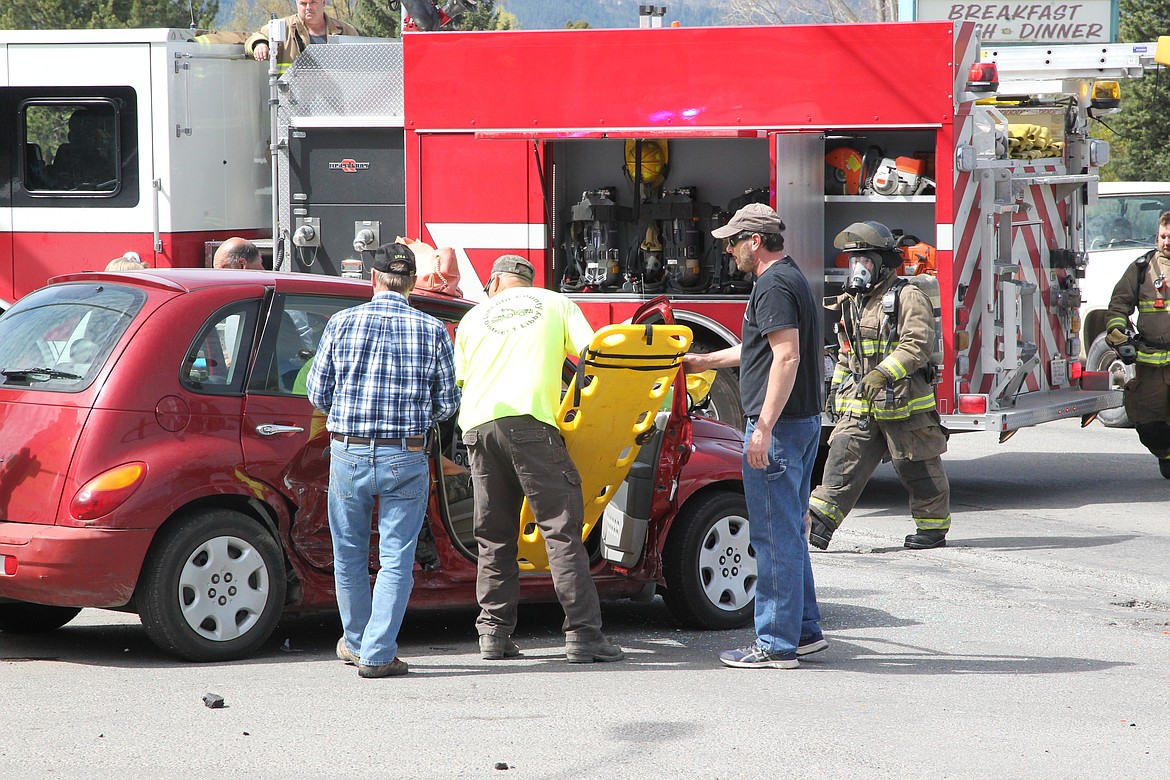 First responders work to extract a passenger from a car that crashed at the intersection of U.S. Highway 2 and Mahoney Road on May 5. Libby Police Chief Scott Kessel said  responders took the injured passenger to Cabinet Peaks Medical Center. The driver of the red PT Cruiser was cited for failure to yield right of way. Responders with Libby Volunteer Ambulance, Lincoln County Sheriff's Office, Libby Volunteer Fire Department reported to the scene.