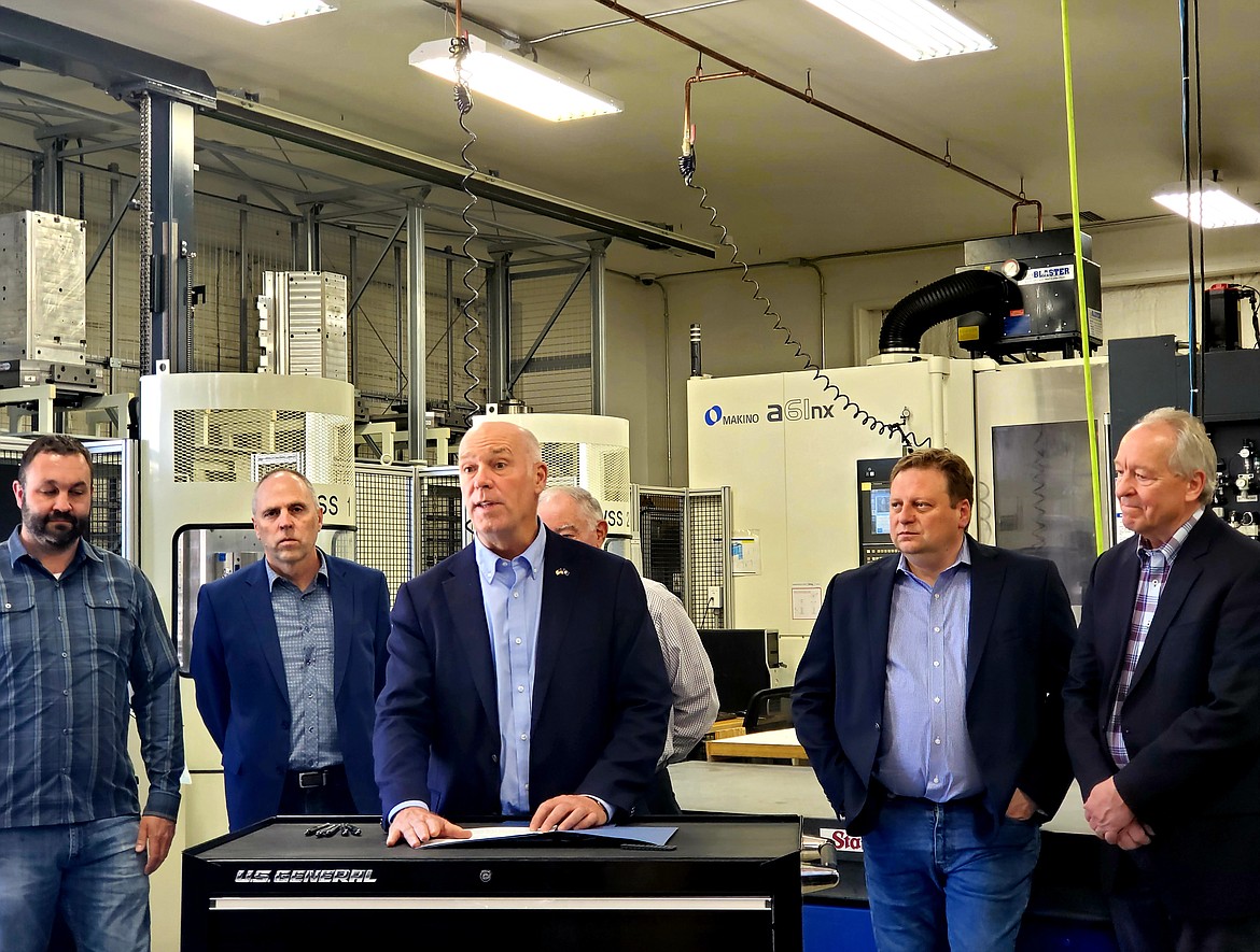 Montana Gov. Greg Gianforte speaks Thursday, May 6, 2021, at Thompson Precision, a machining and fabrication company in Kalispell, flanked by Steven Thompson; state Sen. Greg Hertz, R-Polson; Ray Thompson; Sen. Mark Blasdel, R-Kalispell; and Scott Ostermann, director of the state Department of Commerce. Gianforte was there to sign and promote two bills that cut income taxes and rewrote other parts of the state tax code. (Chad Sokol/Daily Inter Lake)