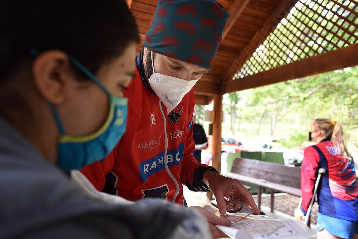 Grizzly Orienteering founder Boris Granovskiy gives some last-minute advice to a newcomer at the orienteering event at Lone Pine State Park Sunday. (Jeremy Weber/Daily Inter Lake)