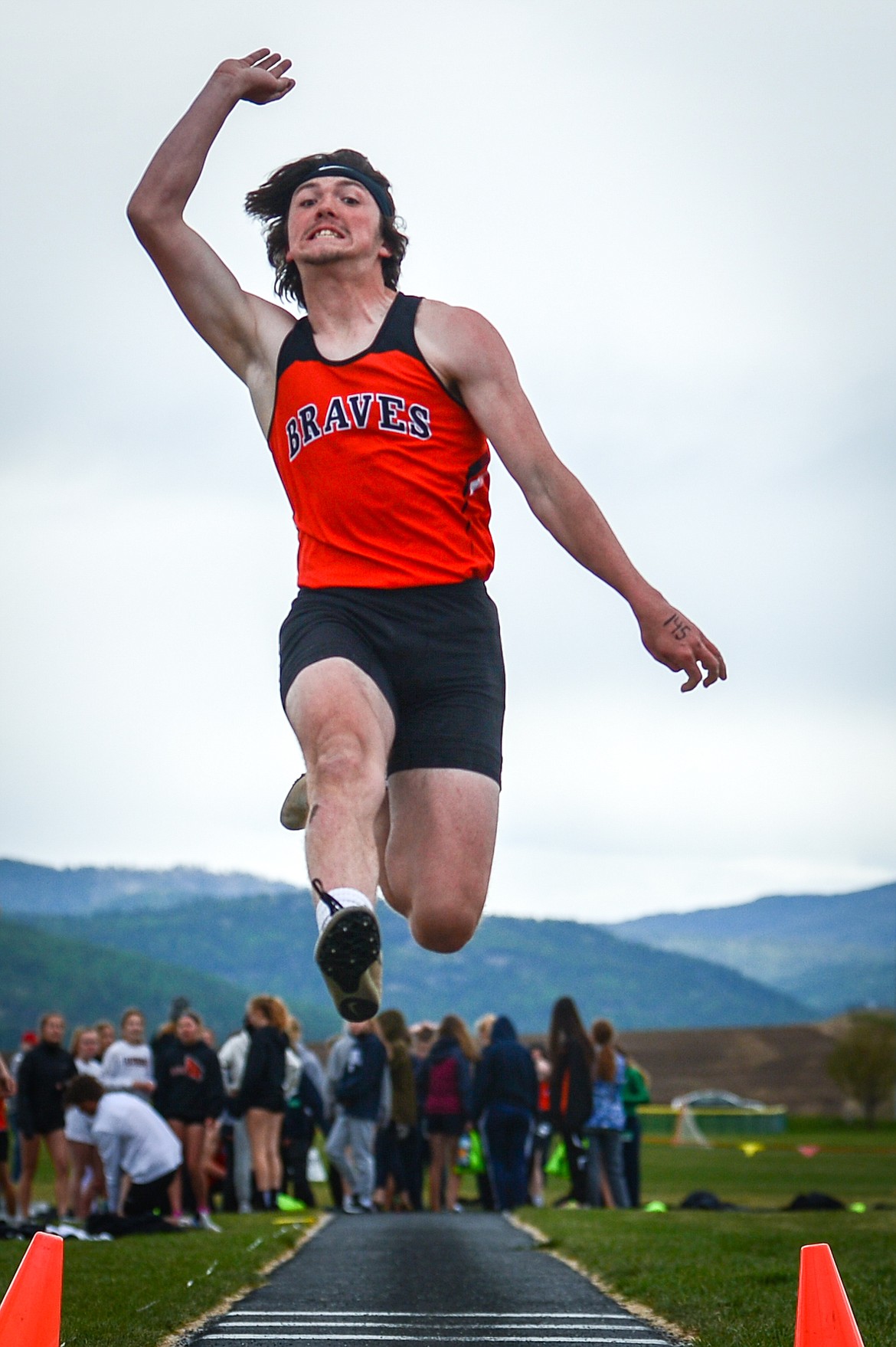 Flathead's Nic Gustafson competes in the long jump during a crosstown meet against Glacier at Glacier High School on Friday. (Casey Kreider/Daily Inter Lake)