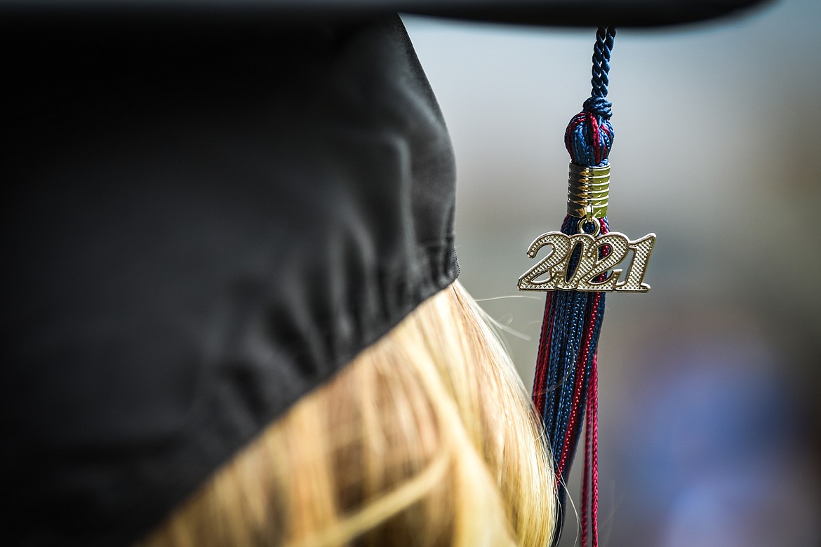 The year 2021 hangs from the tassel and mortarboard of a graduate at the Flathead Valley Community College commencement ceremony at Legends Stadium on Friday. (Casey Kreider/Daily Inter Lake)