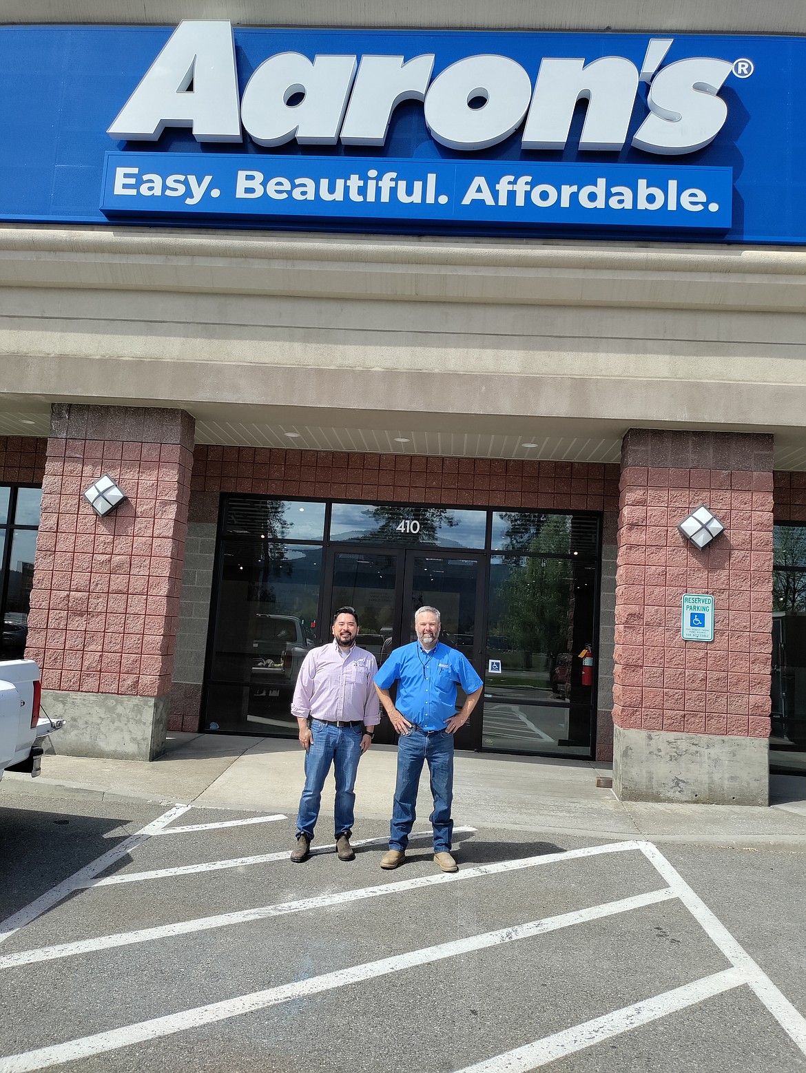 Courtesy photo
Employees David Hong and David Lyons stand in front of Aaron's Furniture, Electronics and Appliances, now located in the former Pier 1 Imports location at 410 W. Wilbur (west of U.S. 95).