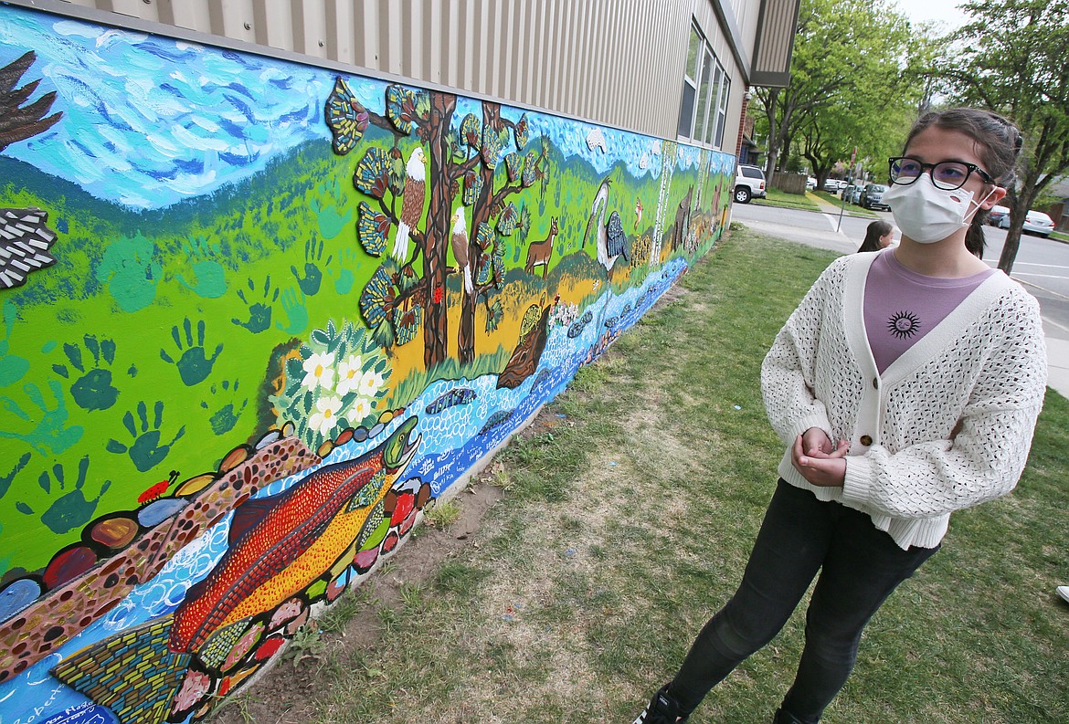 Sorensen Magnet School fifth-grader Gabriella Johnson on Friday discusses what she enjoyed about working on the new mural outside of the school, which was finished on Thursday.
