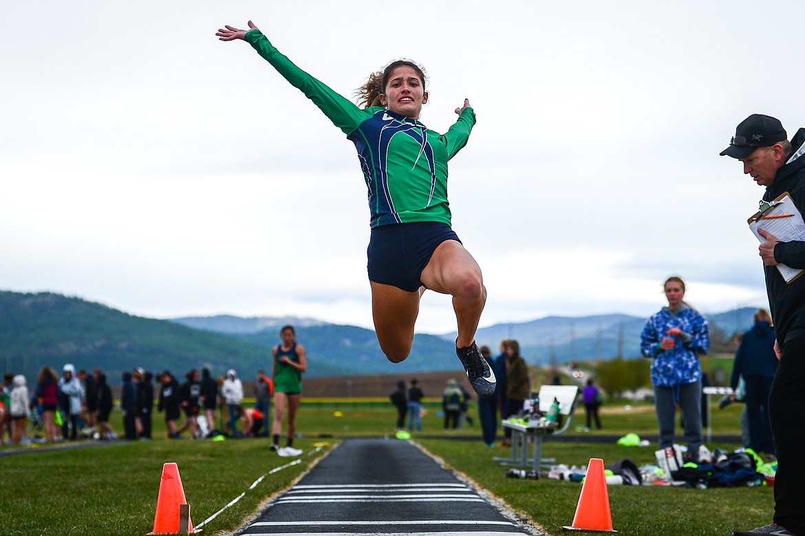 Glacier's Taylor Brisendine competes in the long jump during a crosstown meet with Flathead at Glacier High School on Friday. (Casey Kreider/Daily Inter Lake)