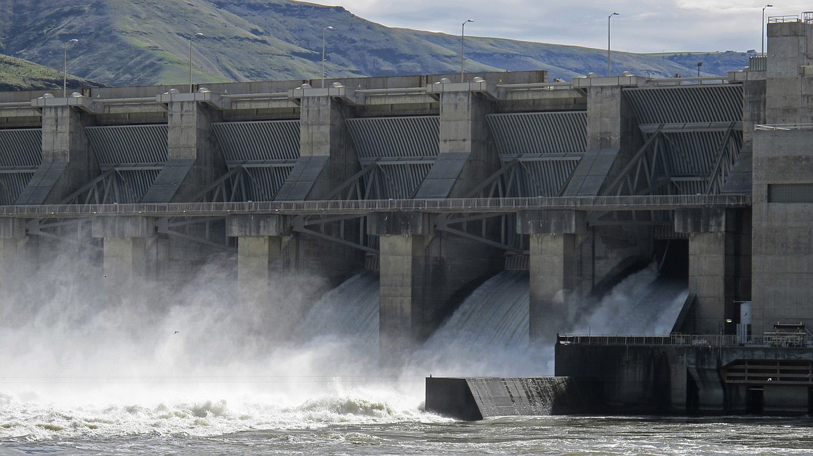 In this April 11, 2018, file photo, water moves through a spillway of the Lower Granite Dam on the Snake River near Almota, Wash. Some Republican members of Congress from the Northwest are accusing a GOP Idaho lawmaker of conducting secret negotiations with the Democratic governor of Oregon over a controversial proposal to breach four dams on the Snake River to save endangered salmon runs.