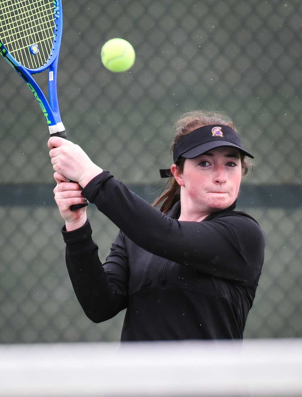 Flathead's Kami Darrow hits a backhand return against Missoula Sentinel's Grace Hurteau at Flathead Valley Community College on Saturday. (Casey Kreider/Daily Inter Lake)