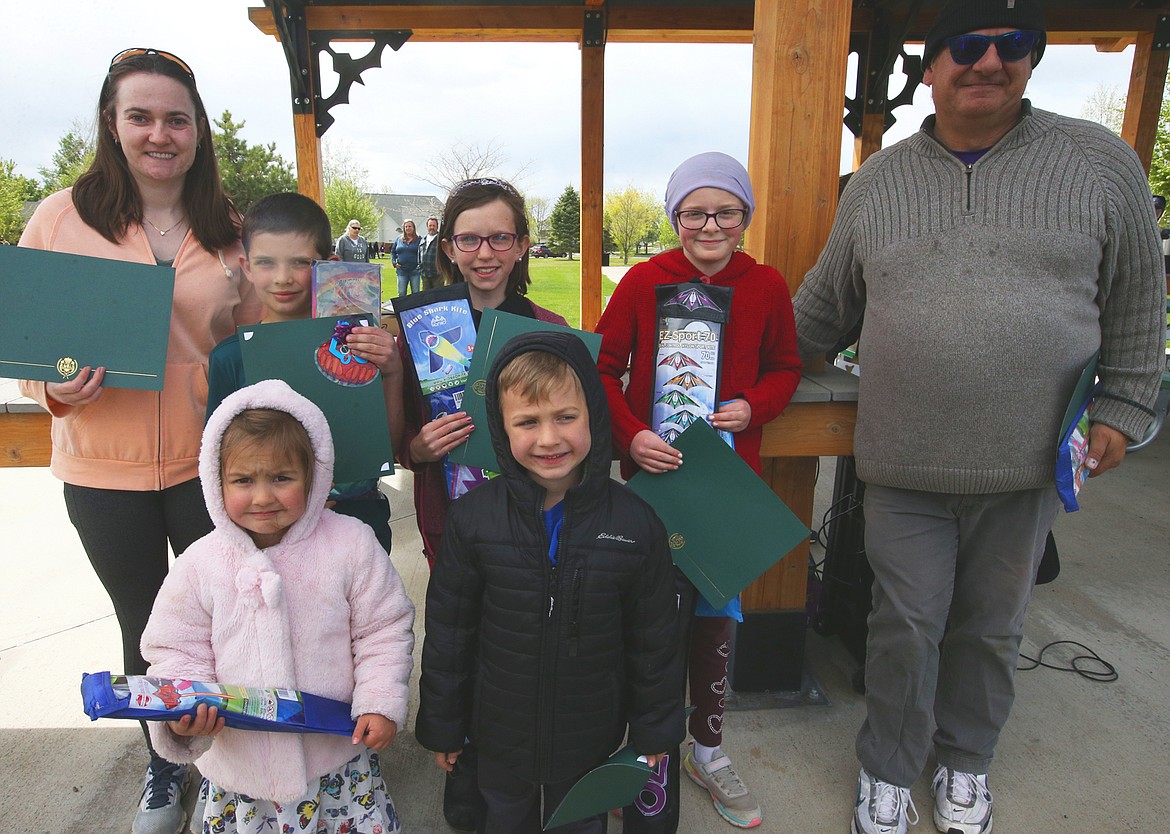 Category winners at the Hayden Kite Festival on Saturday display their prizes of certificates and kites. Back row from left, Rebecca Perry, Isaac Pelphrey, Rhea Buntin and Claire Arpke. Front row are Emma and Mason Weinberger.