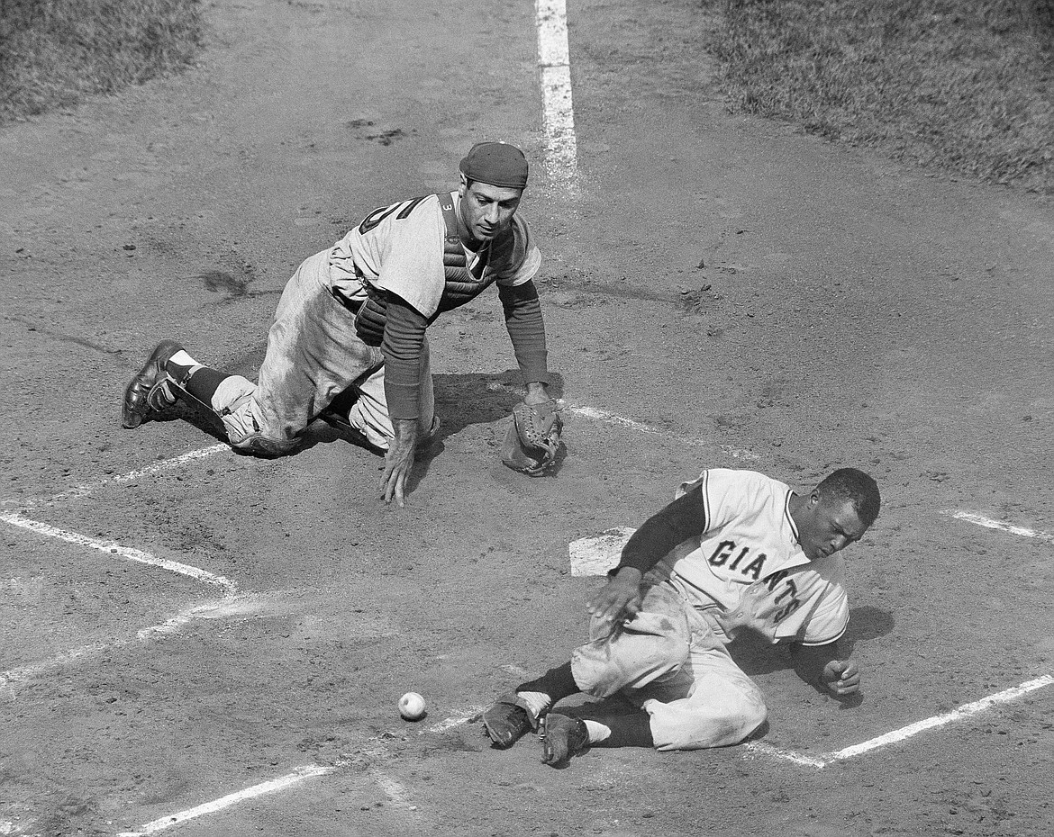 JOHN ROONEY/Associated Press
Willie Mays scores on an inside-the-park homer while playing with the New York Giants in a game against the Philadelphia Phillies at the Polo Grounds in New York on May 30, 1957.