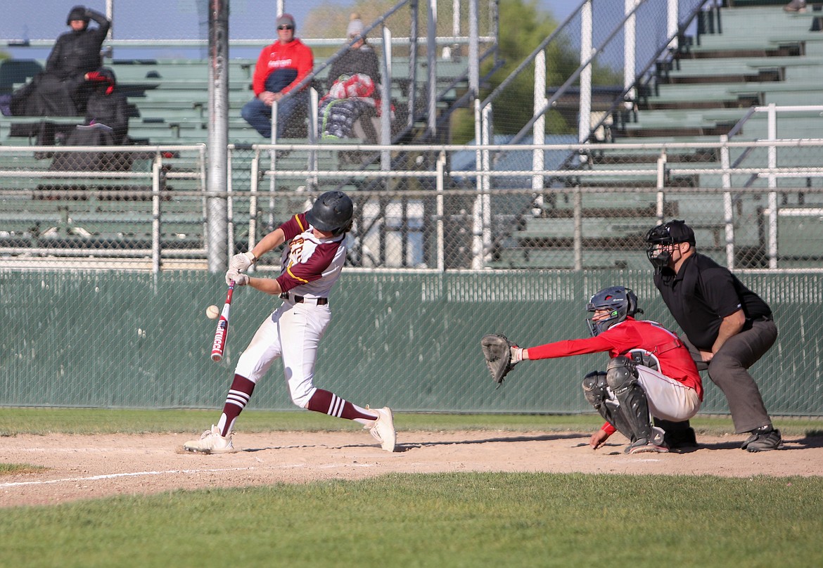 Seth Olson knocks a hit for Moses Lake as the Chiefs mount a comeback in the first game of the doubleheader versus Eastmont High School on Friday afternoon at Larsen Playfield.