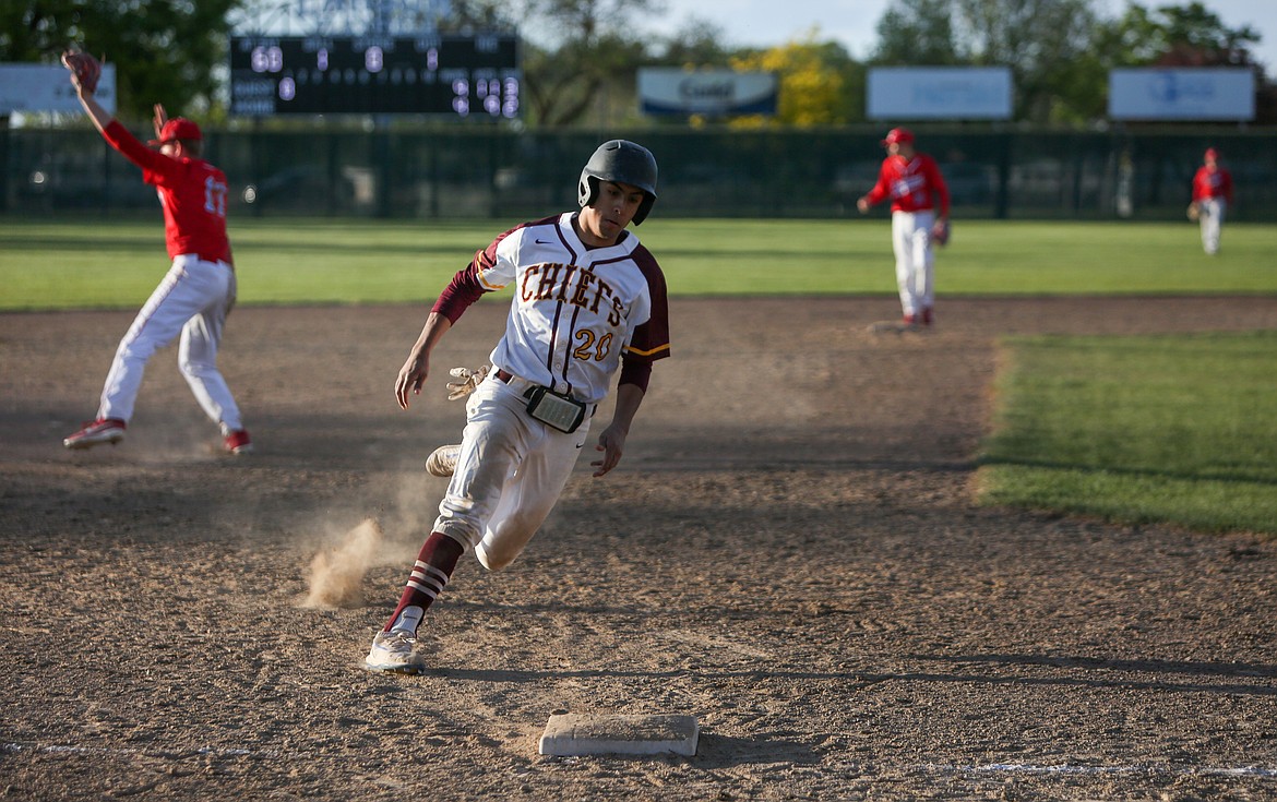 Moses Lake High School's Leo Cortez rounds third base toward home on his way to scoring the winning run in the bottom of the eleventh inning for the Chiefs on Friday afternoon at Larsen Playfield.