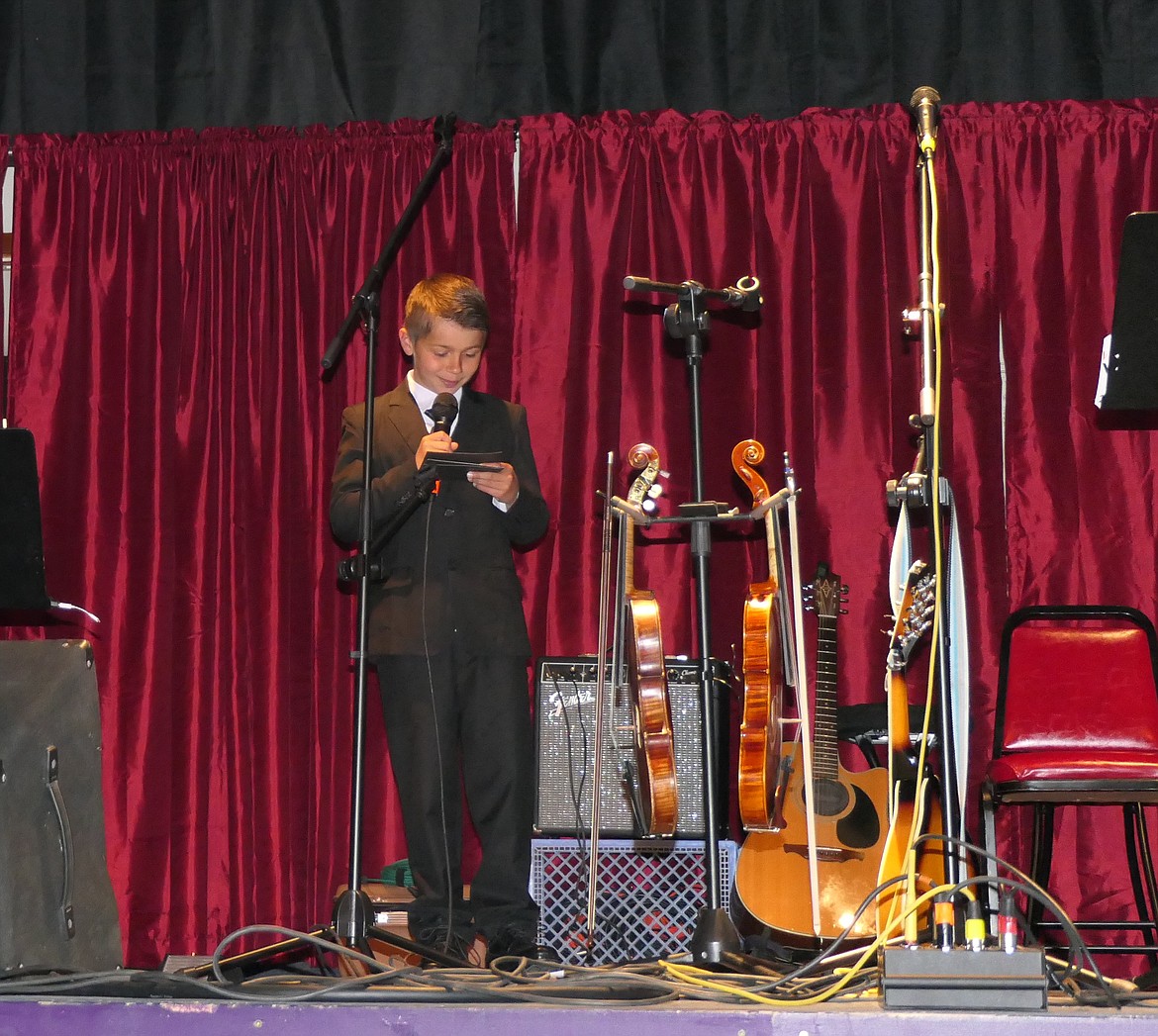 Ethan Traver performs a comedy routine last Friday night at Music for Moms at the Rex Theater in Thompson Falls. (Adam Lindsay/Valley Press)