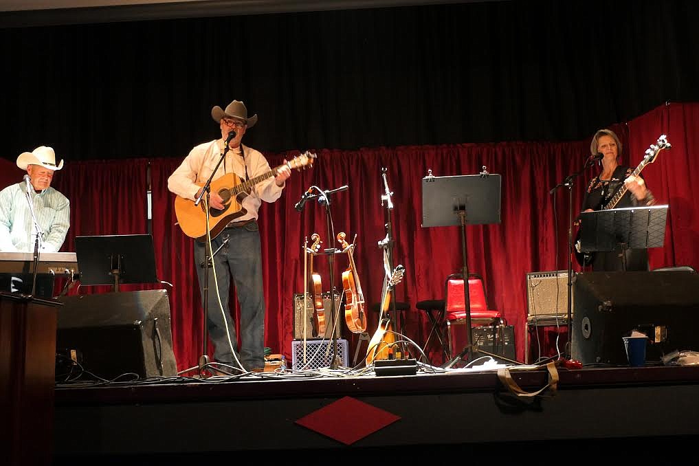 The Western Sky Band, with Keith Myers on guitar and vocals, Deb Oliver on bass and vocals, and Dave Oliver singing, played last Friday night at Music for Moms at the Rex Theater in Thompson Falls. The event was a fundraiser for the Cancer Network of Sanders County. (Adam Lindsay/Valley Press)
