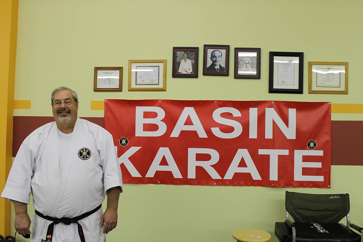 Shihan Terry Stone grins before photos of hanshis Todd, Toyama and Mack at Basin Karate in Moses Lake on Wednesday.