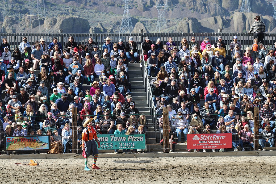 Whistle-Nut the clown commands his crowd at the 64th Colorama Rodeo in Grand Coulee Saturday.