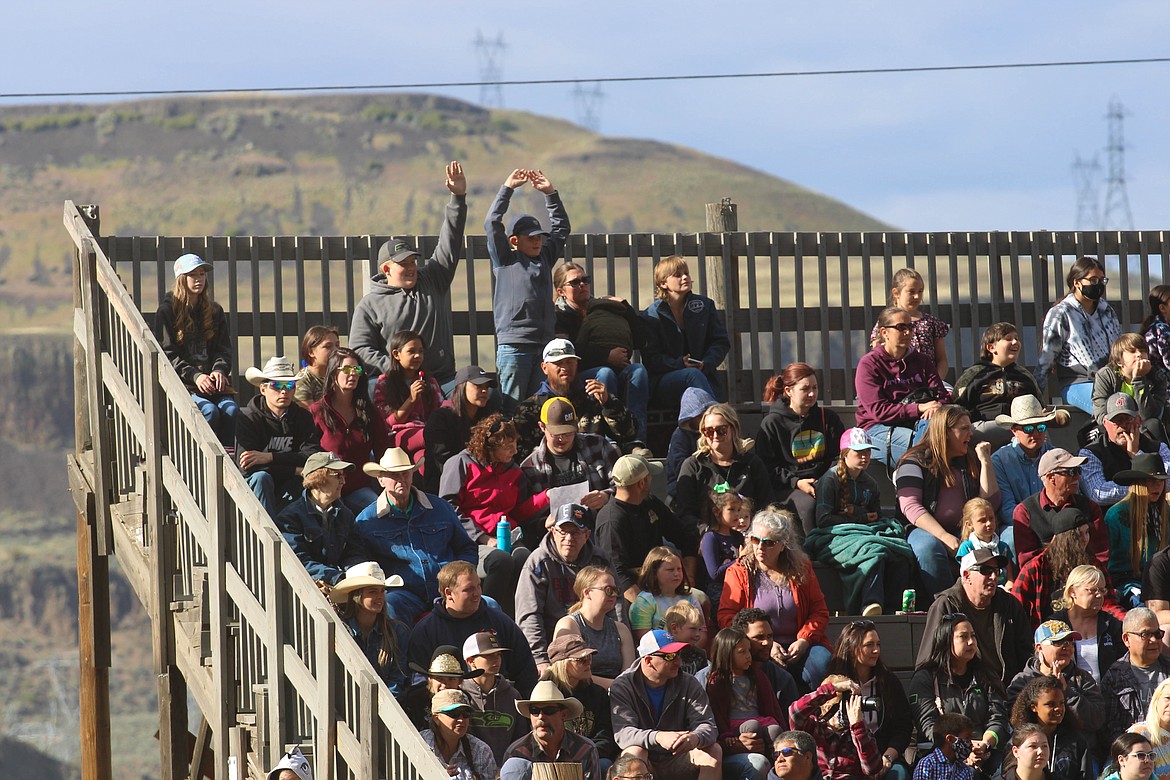 Fans cheer at the 64th Colorama Rodeo in Grand Coulee Saturday.