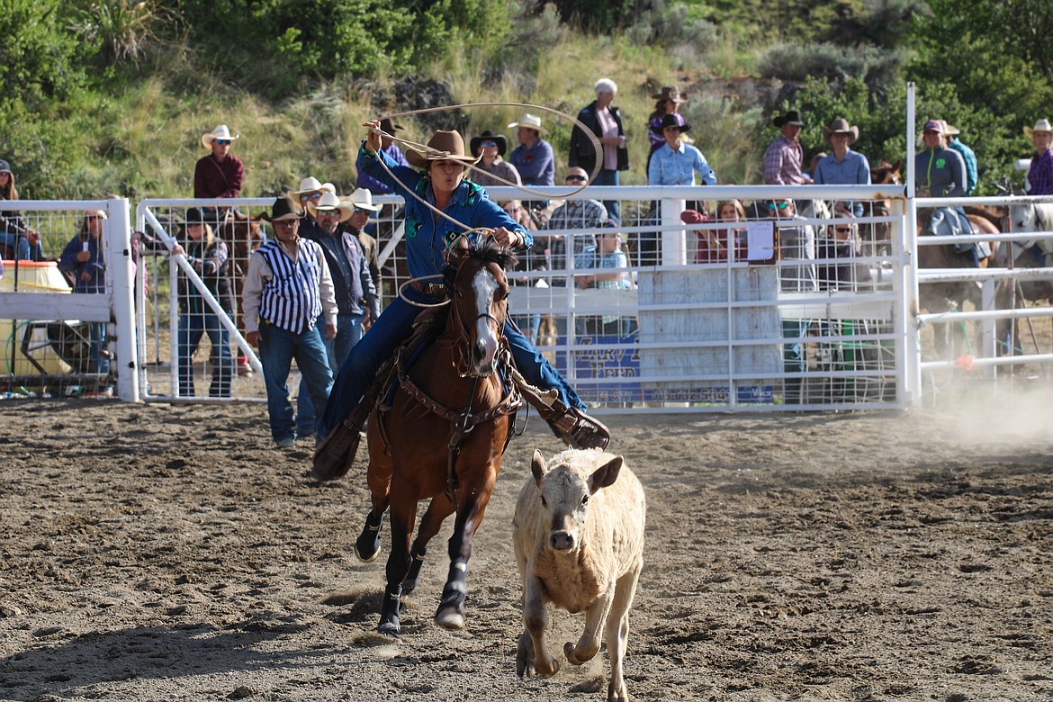 Riley Hanson of Idaho ropes a calf at the 64th Colorama Rodeo in Grand Coulee Saturday.