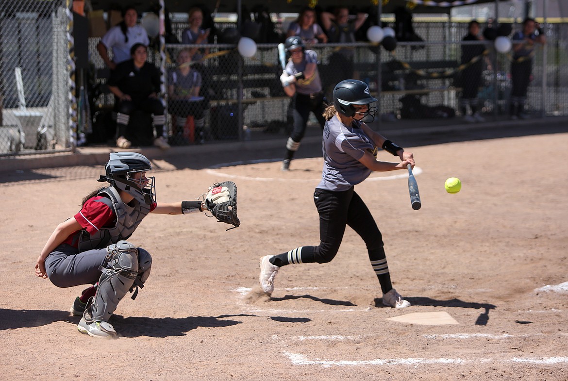 Royal High School's Jaya Griffin makes a hit for the Knights in the 11-1 win over Okanogan High School on Saturday afternoon.