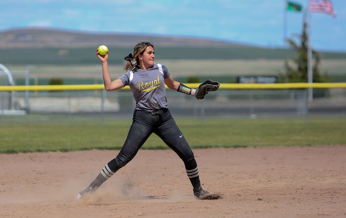 Royal's Chenoa Louie makes a throw to first base from short stop on Saturday afternoon at Royal High School against Okanogan High School.