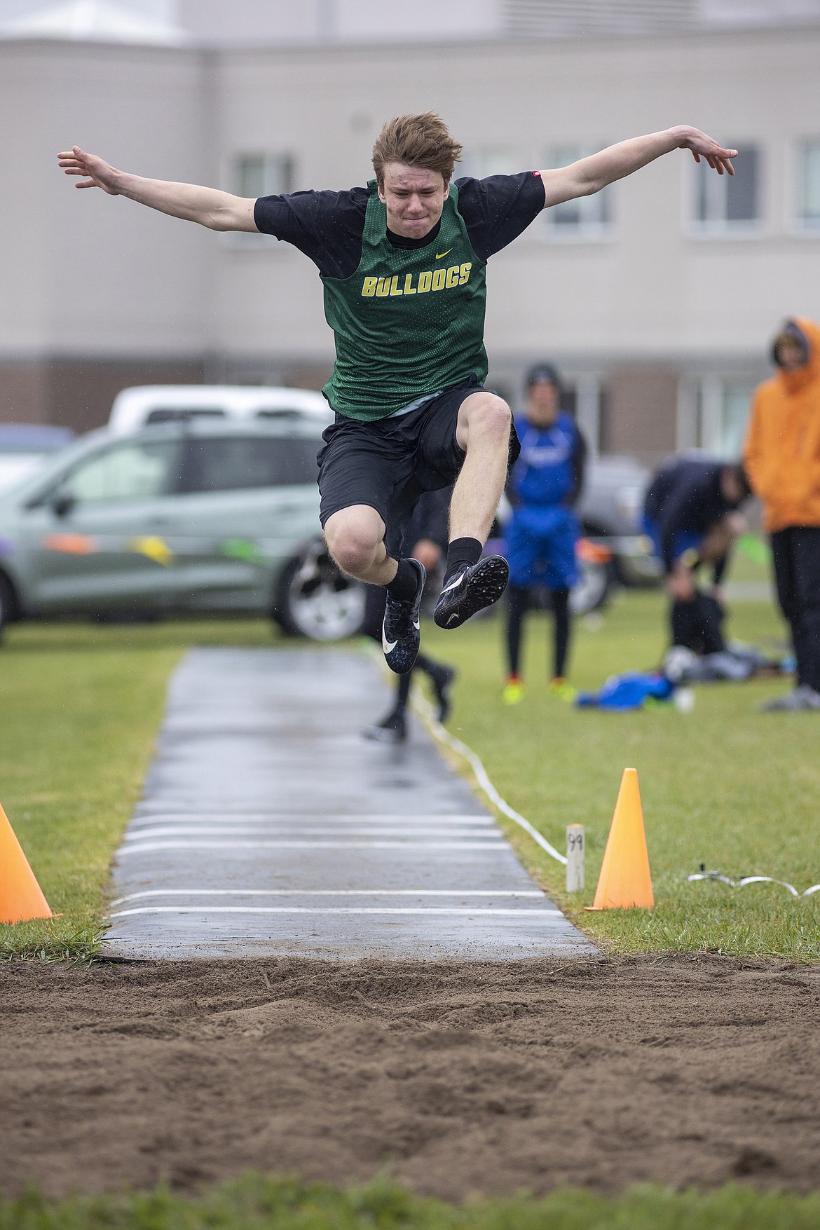Whitefish's Wyatt Kaszuba competes in the boys long jump event at the Columbia Falls Invite on Saturday. (Chris Peterson/Hungry Horse News)