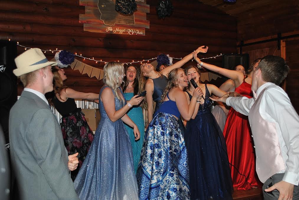 In addition to dancing the night away students at St. Regis prom even enjoyed some ping pong and karaoke in the beautifully decorated event hall at the Nugget Campground. Here the ladies on stage are belting out Sweet Caroline, as Carter Jasper is "Reaching out...touching me...touching you!" (Amy Quinlivan/Mineral Independent)