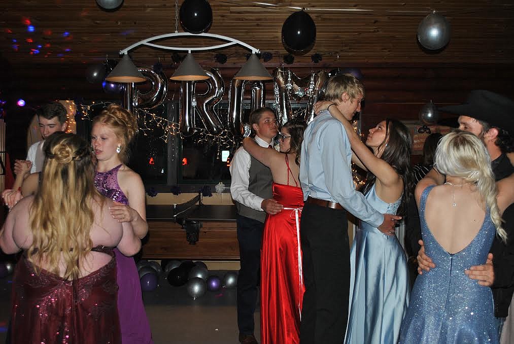 Couples and friends sway to a slow dance Saturday evening at the St. Regis prom, the smaller venue helped make the event feel full of action. (Amy Quinlivan/Mineral Independent)