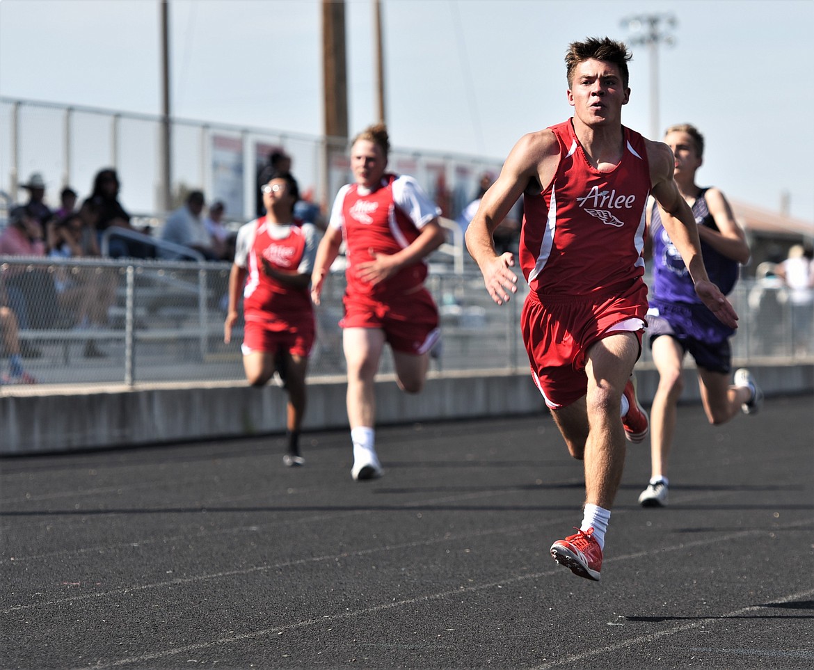 Colt Crawford of Arlee leads the pack during a 100 meters heat Thursday at Ronan. (Scot Heisel/Lake County Leader)