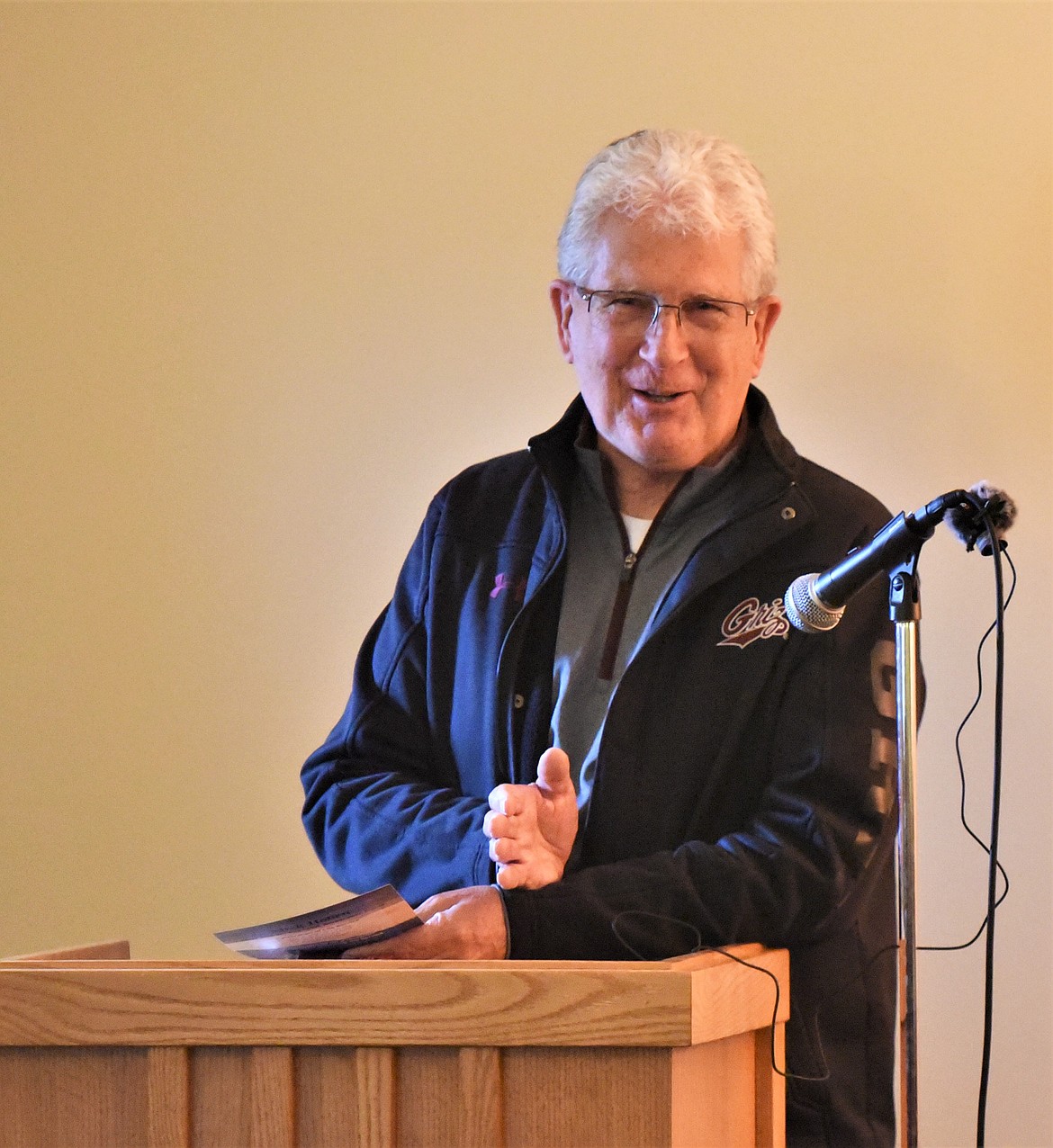 Retired University of Montana Associate Athletic Director Gary Hughes speaks during a memorial service for Mick Holien in Polson. (Scot Heisel/Lake County Leader)