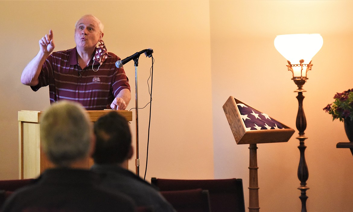 Retired University of Montana athletic trainer Dennis Murphy shares a story about Mick Holien during Saturday's memorial service. (Scot Heisel/Lake County Leader)