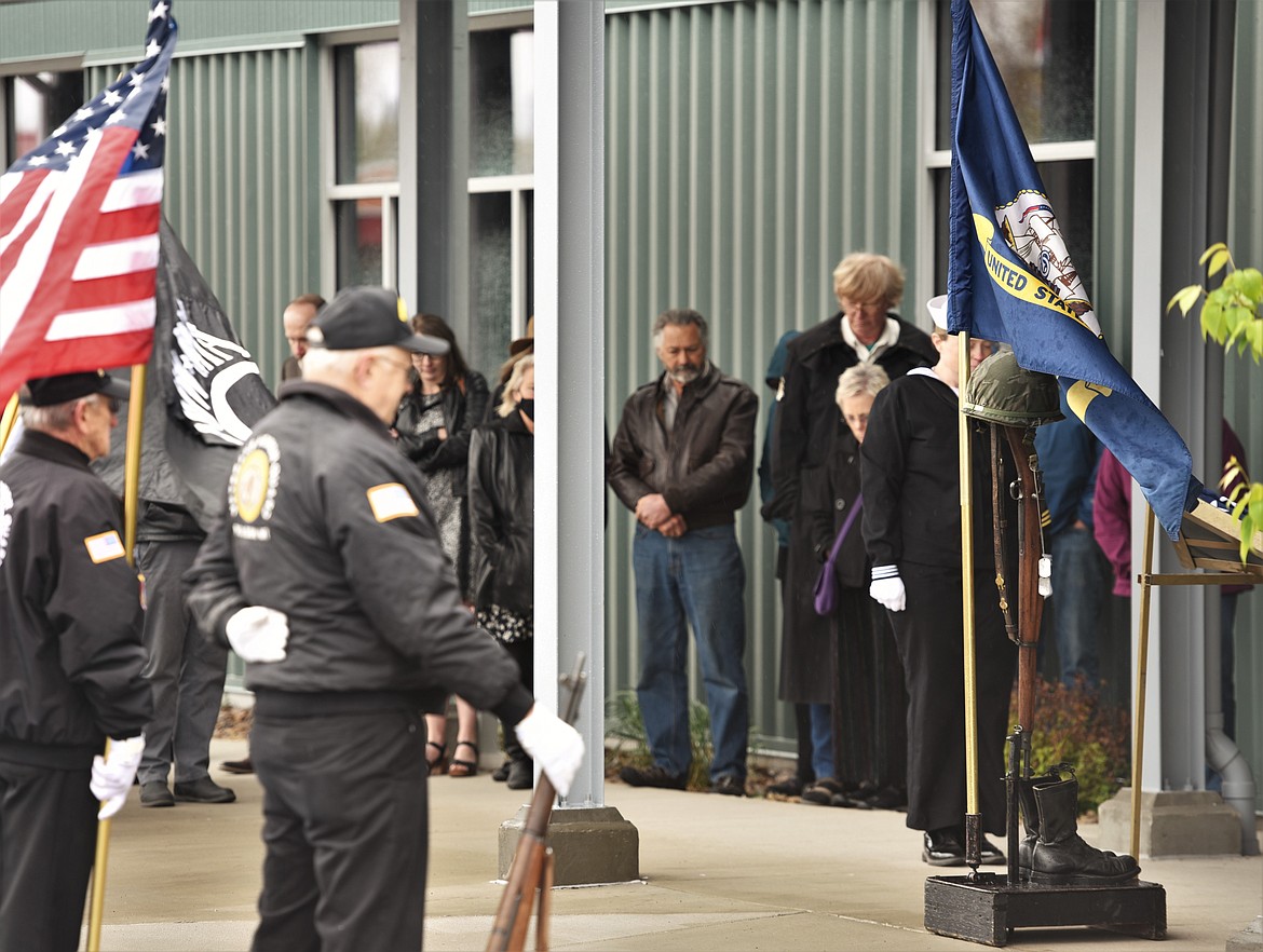 The local Honor Guard pauses for a moment of silence during a ceremony for veteran and former Polson resident Mick Holien, who died in November. (Scot Heisel/Lake County Leader)