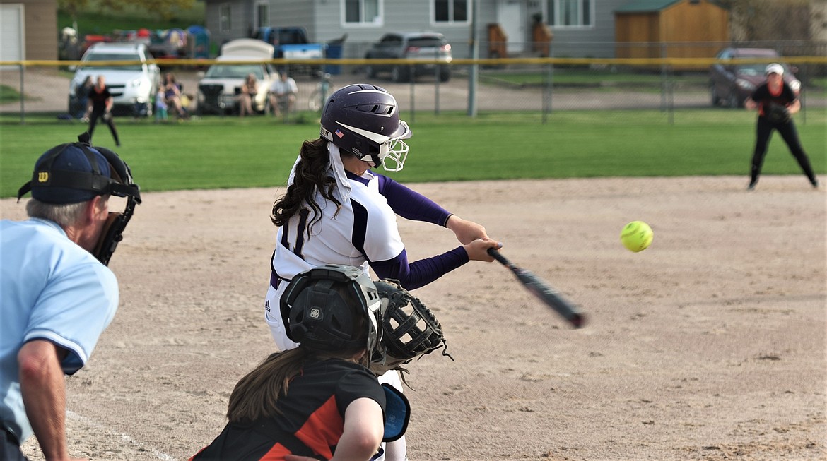 Polson's Lexy Orien takes a swing during the Lady Pirates' home game against Flathead. (Scot Heisel/Lake County Leader)