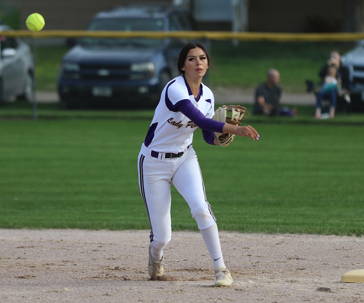 Polson shortstop Josie Caye makes a throw to first base against Flathead. (Courtesy of Bob Gunderson)