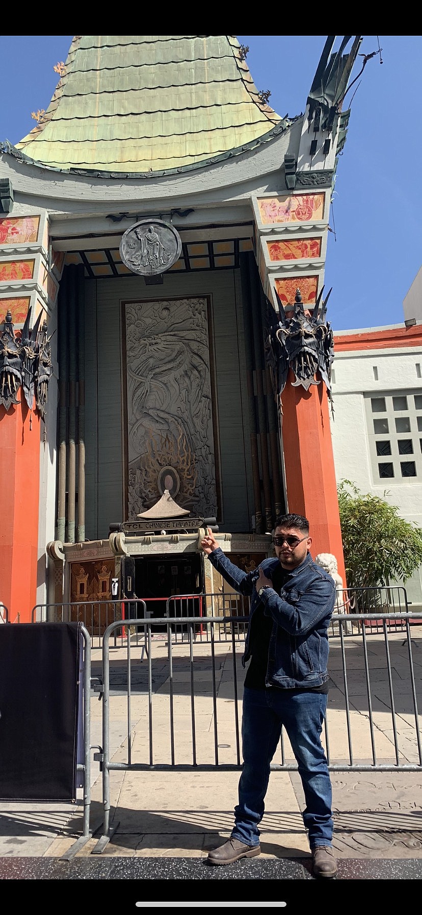 Dino Gonzales points up to the famous TCL Chinese Theater in Los Angeles, California, after visiting recently with his wife on a mini vacation.