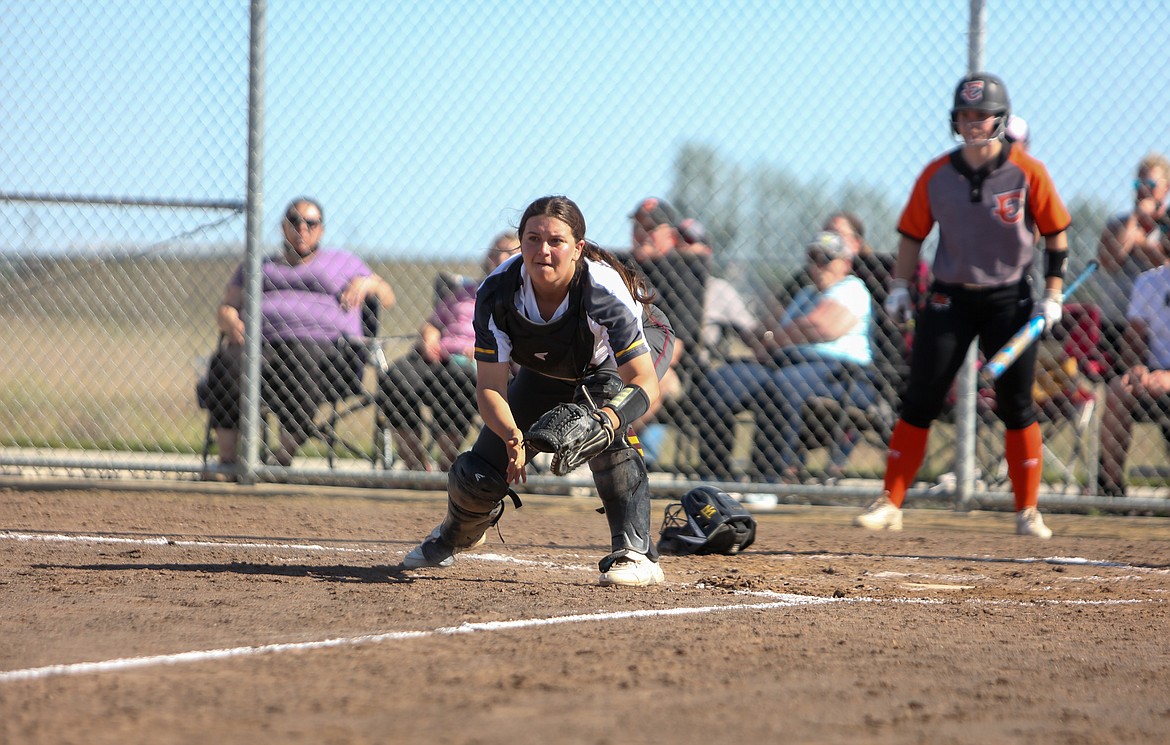 Moses Lake High School senior Taylor Hofheins looks toward third base to cut off the runner on Tuesday afternoon against Ephrata.