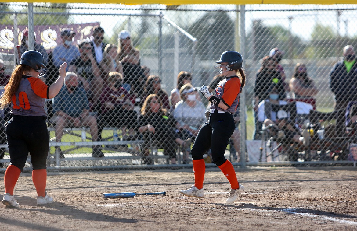 Ephrata High School's Paige Wood crosses home plate to score in the Tigers 3-0 win over Moses Lake High School on Tuesday in Moses Lake.