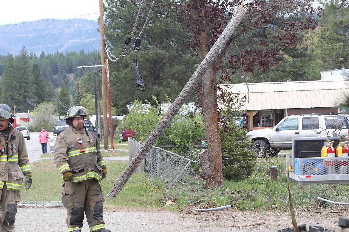 A red truck southbound on U.S. Highway 2 careened off the road, hit a telephone poll and rammed through a building just outside of Libby on May 12. Libby Volunteer Ambulance, Lincoln County Sheriff's Office and Libby Volunteer Fire Department responded to the scene. (Will Langhorne/The Western News)