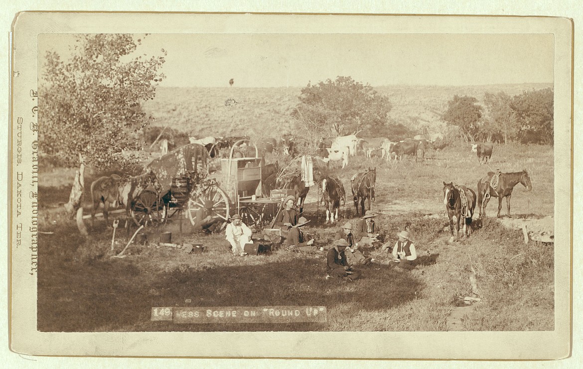 Cowboys at round-up camp site.