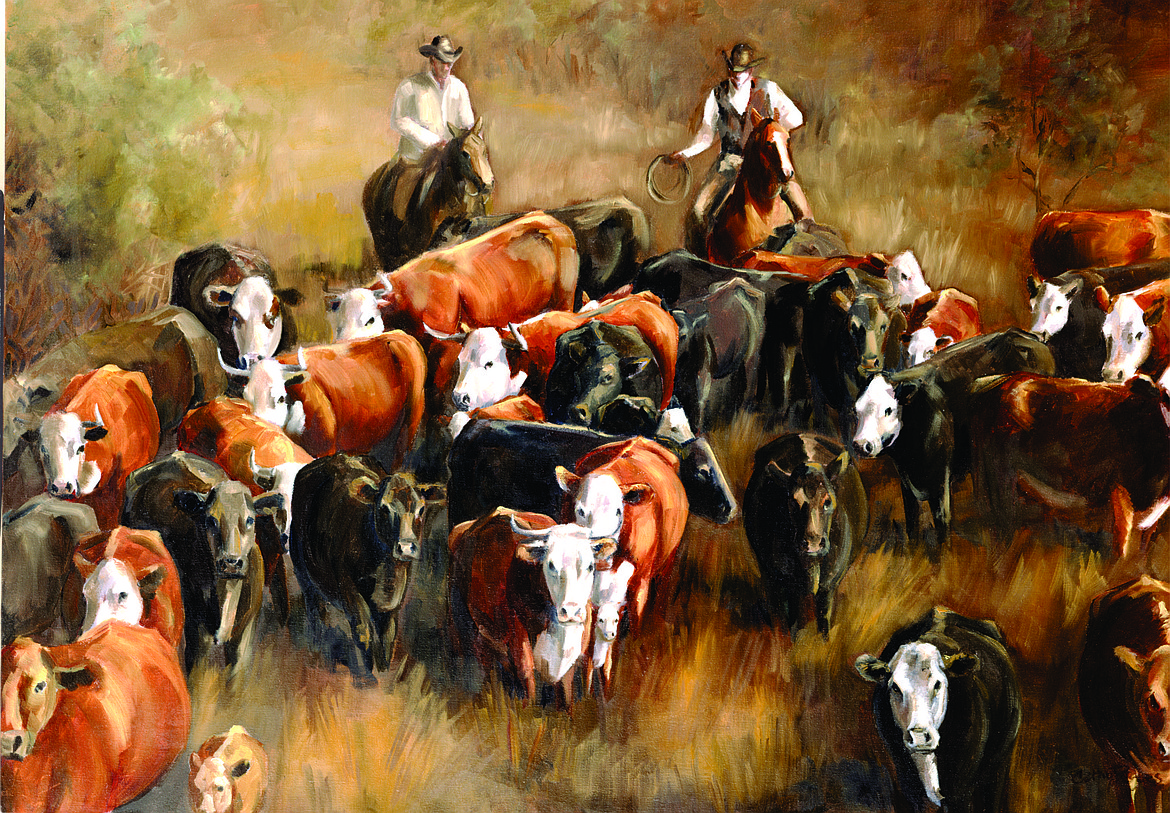 Painting of cowboys herding the cattle.