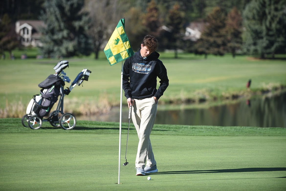 Thompson Falls golfer Kade Pardee prepares to putt during last Wednesday's Class B divisional tournament at the Eagle Bend Golf Course in Bigfork. Pardee carded an 83 to place fourth and qualify for the state tournament. (Scott Shindledecker/Valley Press)