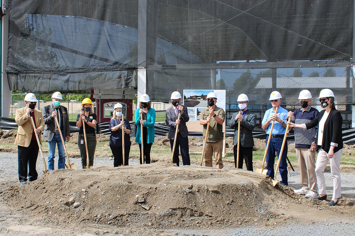 Left to right: Council member Michael Riggs, State Representative Tom Dent, Parks Director Susan Schwiesow, council member Karen Leibrecht, Senator Judy Warnick, Mayor David Curnel, former Parks Director Spencer Grigg, council member Don Myer, Deputy Mayor Daryl Jackson, Council member Dean Hankins and City Manager Allison Williams hold shovels at the groundbreaking ceremony for the new Larson Recreation Center on Wednesday.