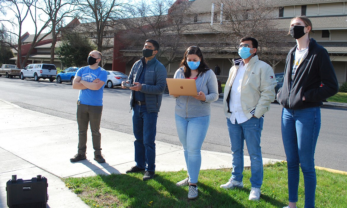 University of Idaho computer science major Isabel Hinkle of Coeur d'Alene, center, is seen here with her team during a field test on a special computer they built for their capstone project. Pictured from left: Jonathan Gift, the team's client Dr. Dev Strestha, Hinkle, Oshan Karki and Victoria Gehring.