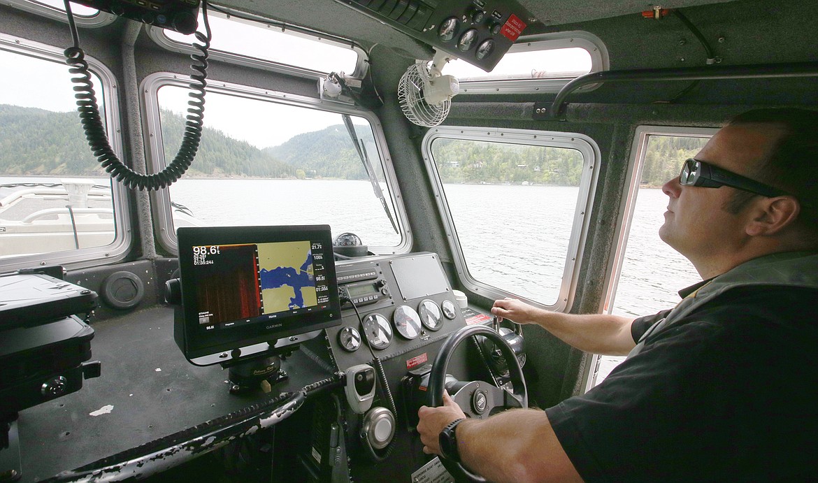 Kootenai County Sheriff's Office Sgt. Ryan Miller heads out on Lake Coeur d'Alene Wednesday to check on training exercises for marine deputies.