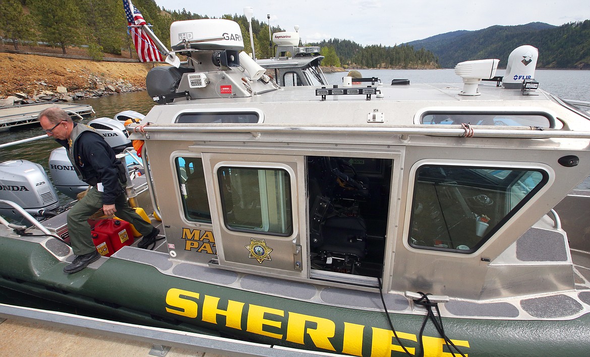 Kootenai County Sheriff’s Marine Deputy Gerald Wallace departs a boat at Higgens Point on Wednesday.