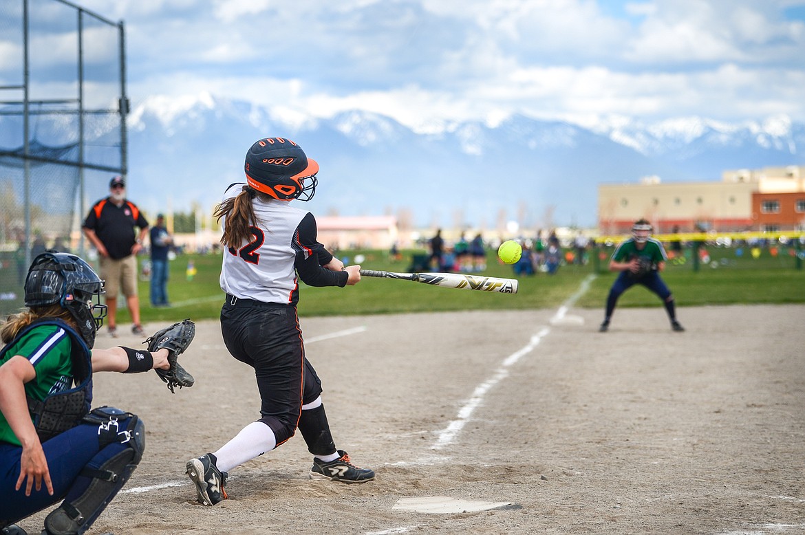 Flathead's Laynee Vessar (12) connects on a single in the second inning against Glacier at Glacier High School on Thursday. (Casey Kreider/Daily Inter Lake)