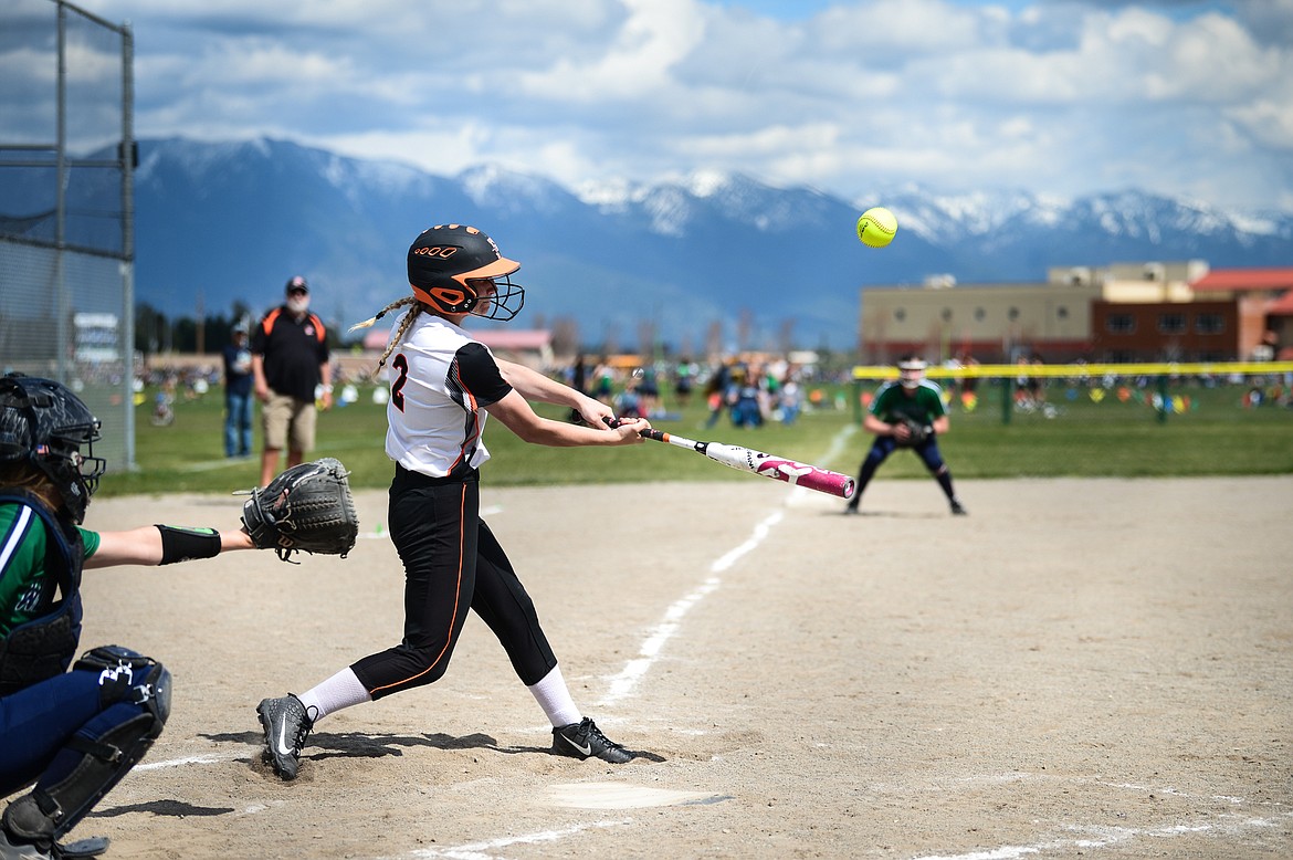 Flathead's Alyssa Poe-Hatton (2) connects in the second inning against Glacier at Glacier High School on Thursday. (Casey Kreider/Daily Inter Lake)