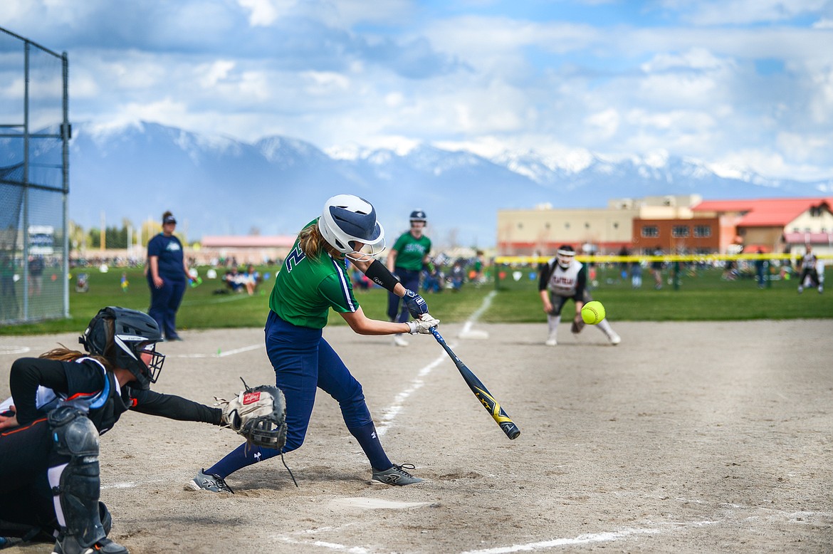 Glacier's Halle Schroeder (2) brings in two runs with a double against Flathead at Glacier High School on Thursday. (Casey Kreider/Daily Inter Lake)