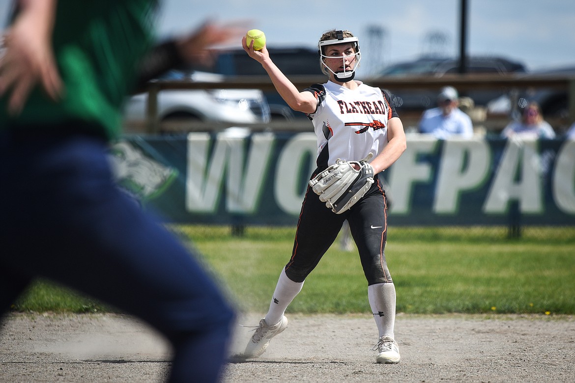 Flathead second baseman Alyssa Cadwalader (9) fields a grounder and throws to first for the out against Glacier at Glacier High School on Thursday. (Casey Kreider/Daily Inter Lake)