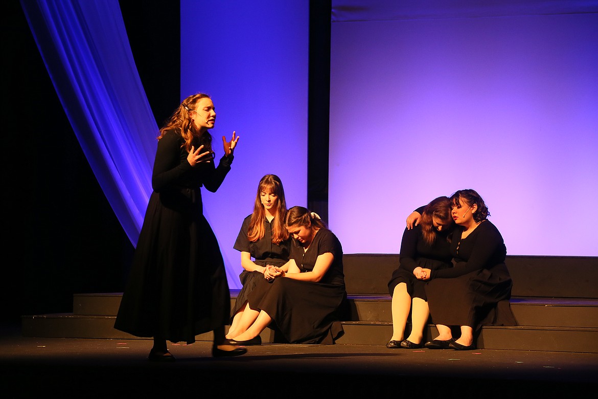 Christian Center School junior Isabelle James at rehearsal Wednesday cries as a newly widowed missionary during a scene from "Bridge of Blood," which opens today. Also pictured, from left: Sierra Arnspiger, sophomore; Emma Marshall, senior; Josie Kelley, junior; and Jaelynn Bunce, sophomore.